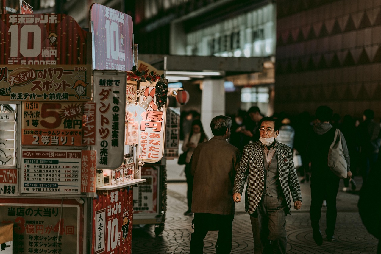 Shop signs crowding a shopping street in Japan