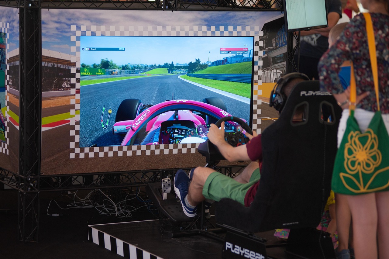 A racing game on a big screen at a gaming event