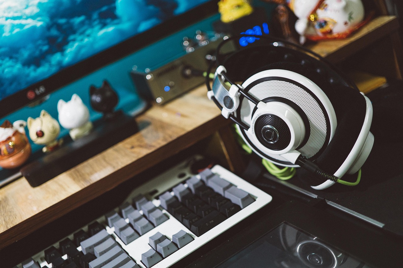 A gaming headset and keyboard on a desk