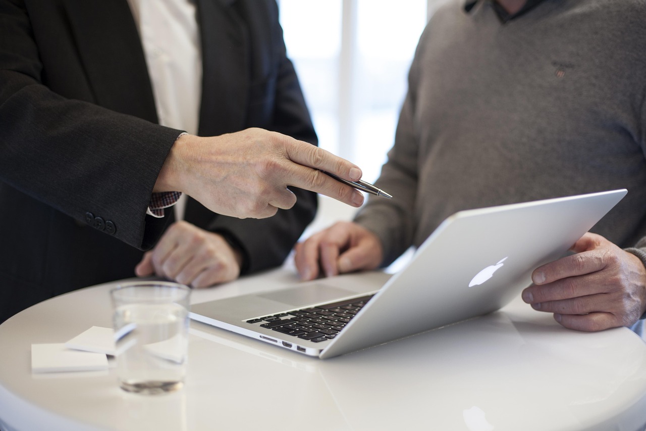 A consultant meeting a client over a laptop