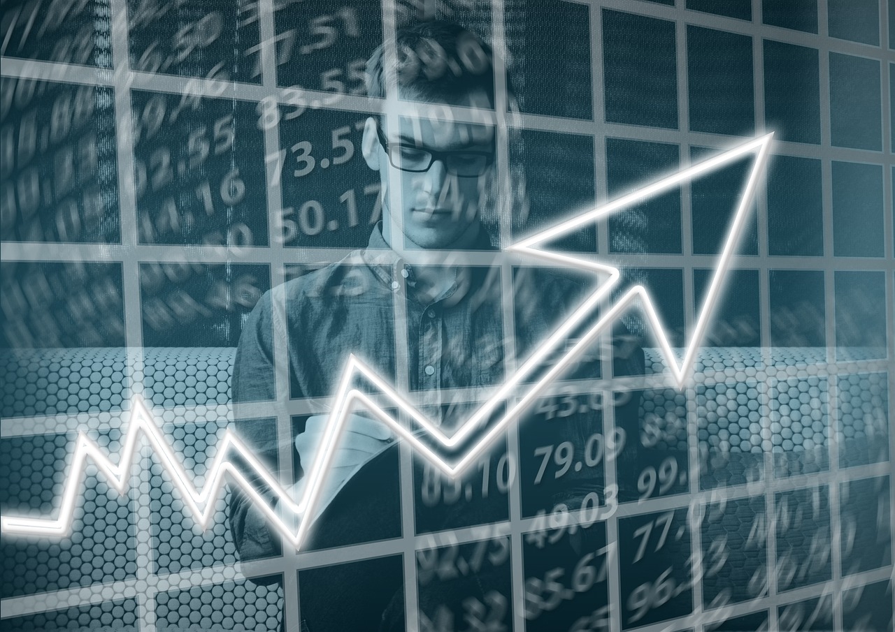 A rising arrow over market data