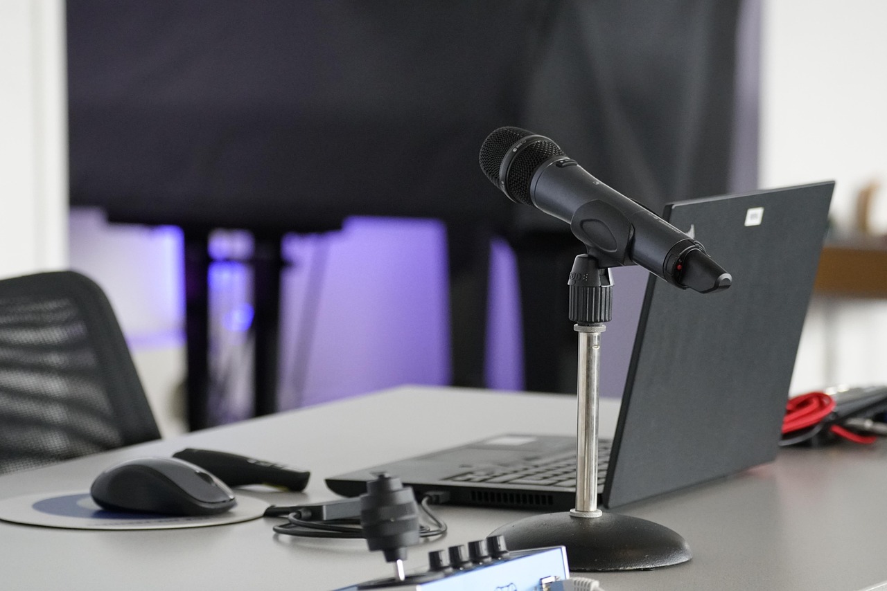 A microphone and laptop set up for streaming