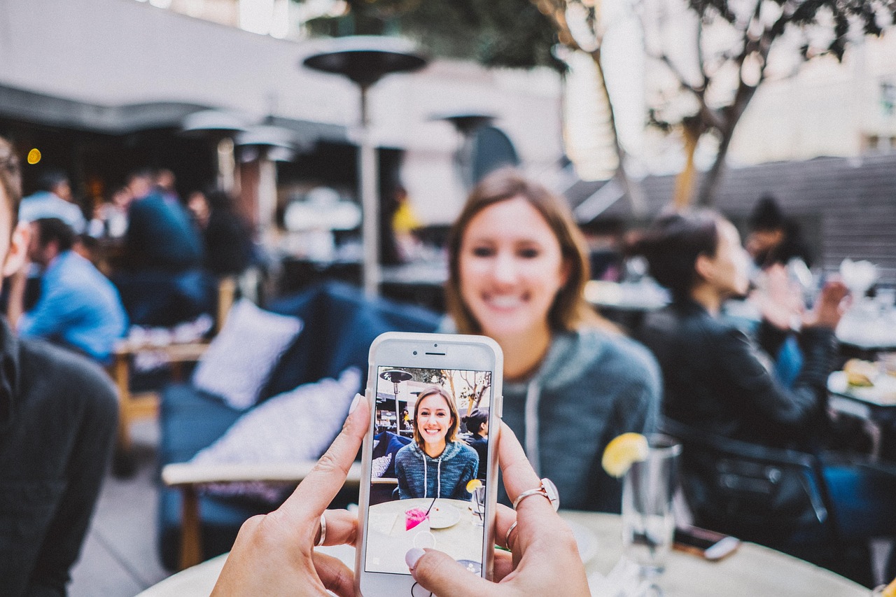 Friends taking a selfie at a cafe