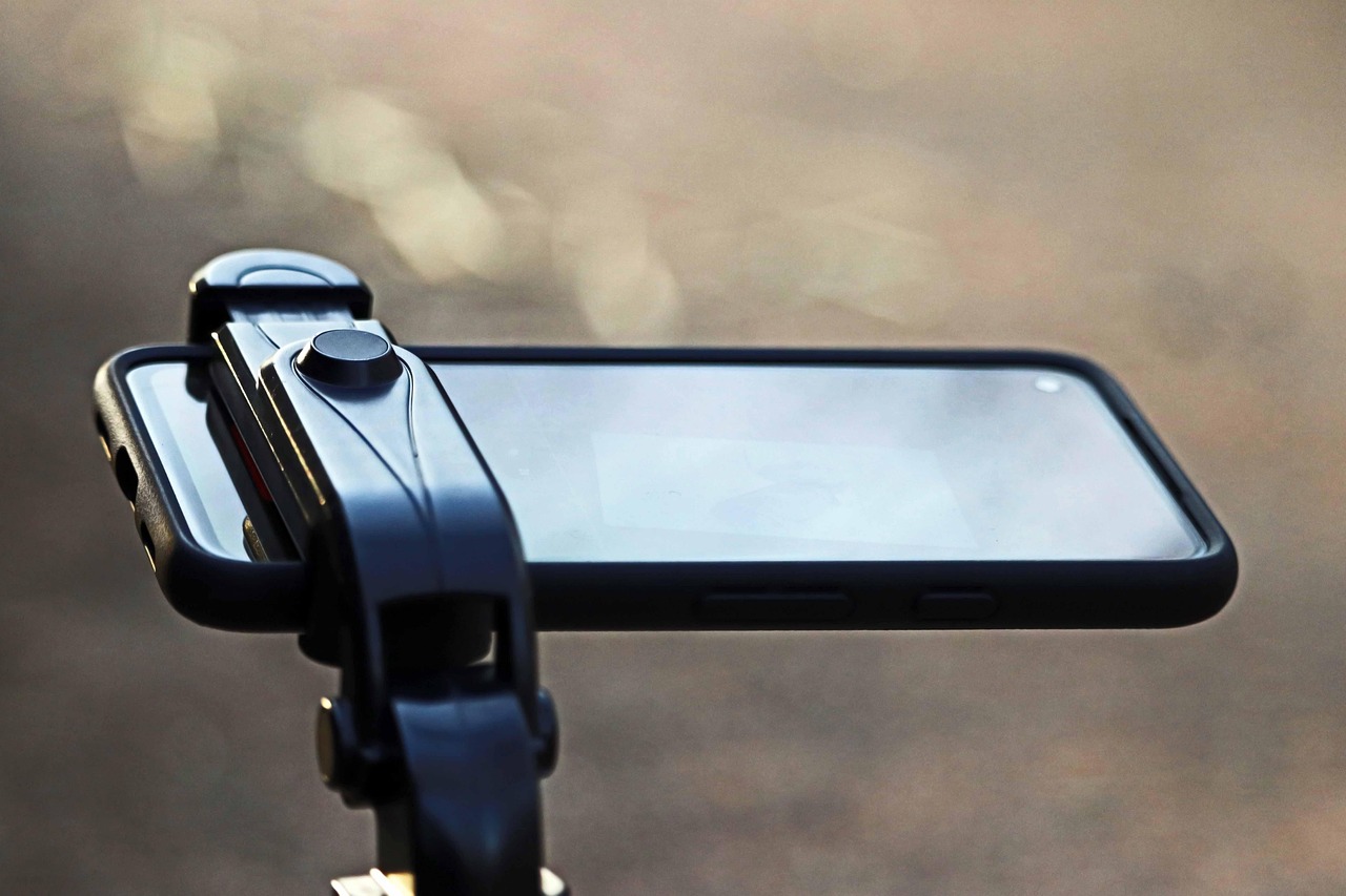 A smartphone mounted on a tripod