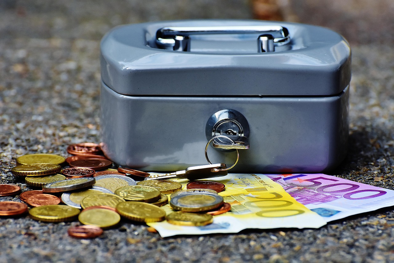 A cash box with coins and banknotes