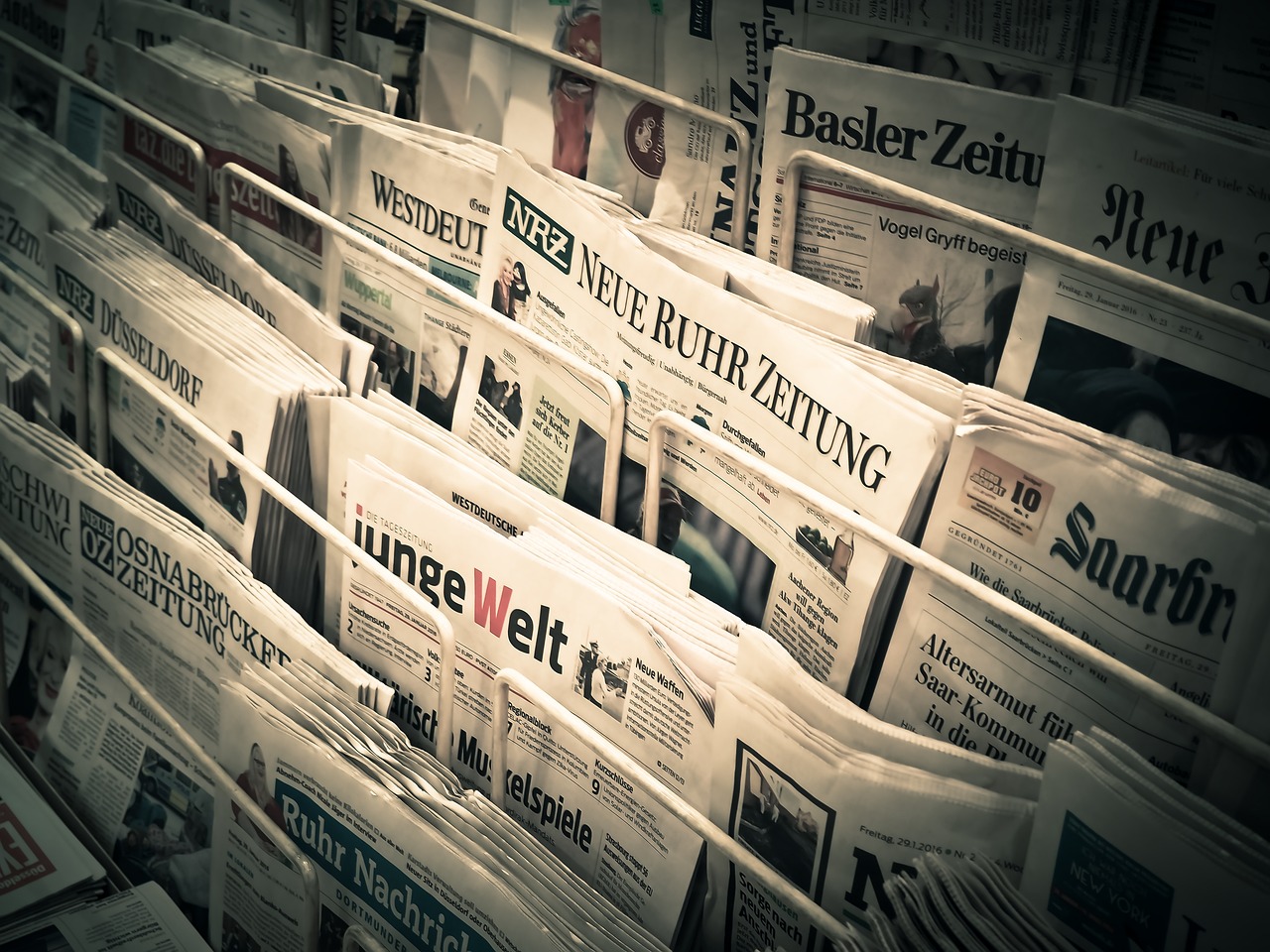 A stack of newspapers on a rack